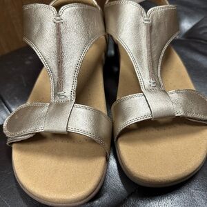 Never worn Metallic gold Taos Sandles. Never worn